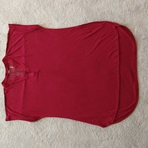 A cranberry red T-shirt with cap sleeves